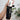 Colostrum Daily Hydrating Cream in White Bottle Coming out of black packaging