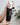Colostrum Daily Hydrating Cream in White Bottle Coming out of black packaging