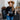 Teen-aged girl standing with cowboy hat on wearing black crewneck with the Royal Family Farms Crown Log